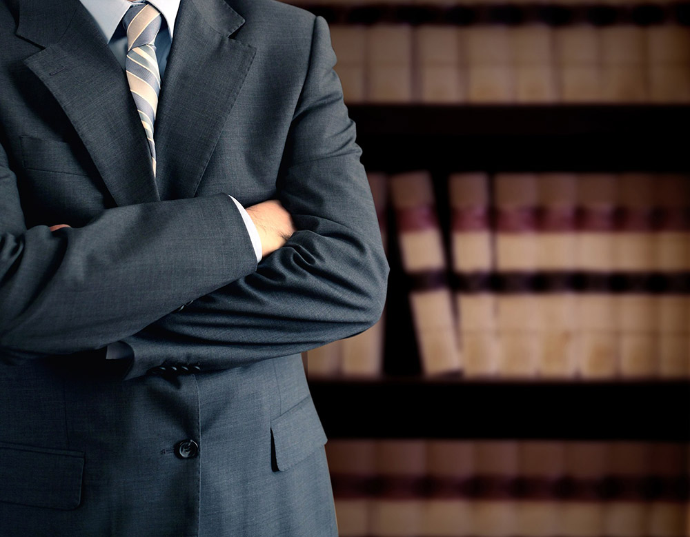 photodune-2277503-businessman-in-front-of-bookcase-m